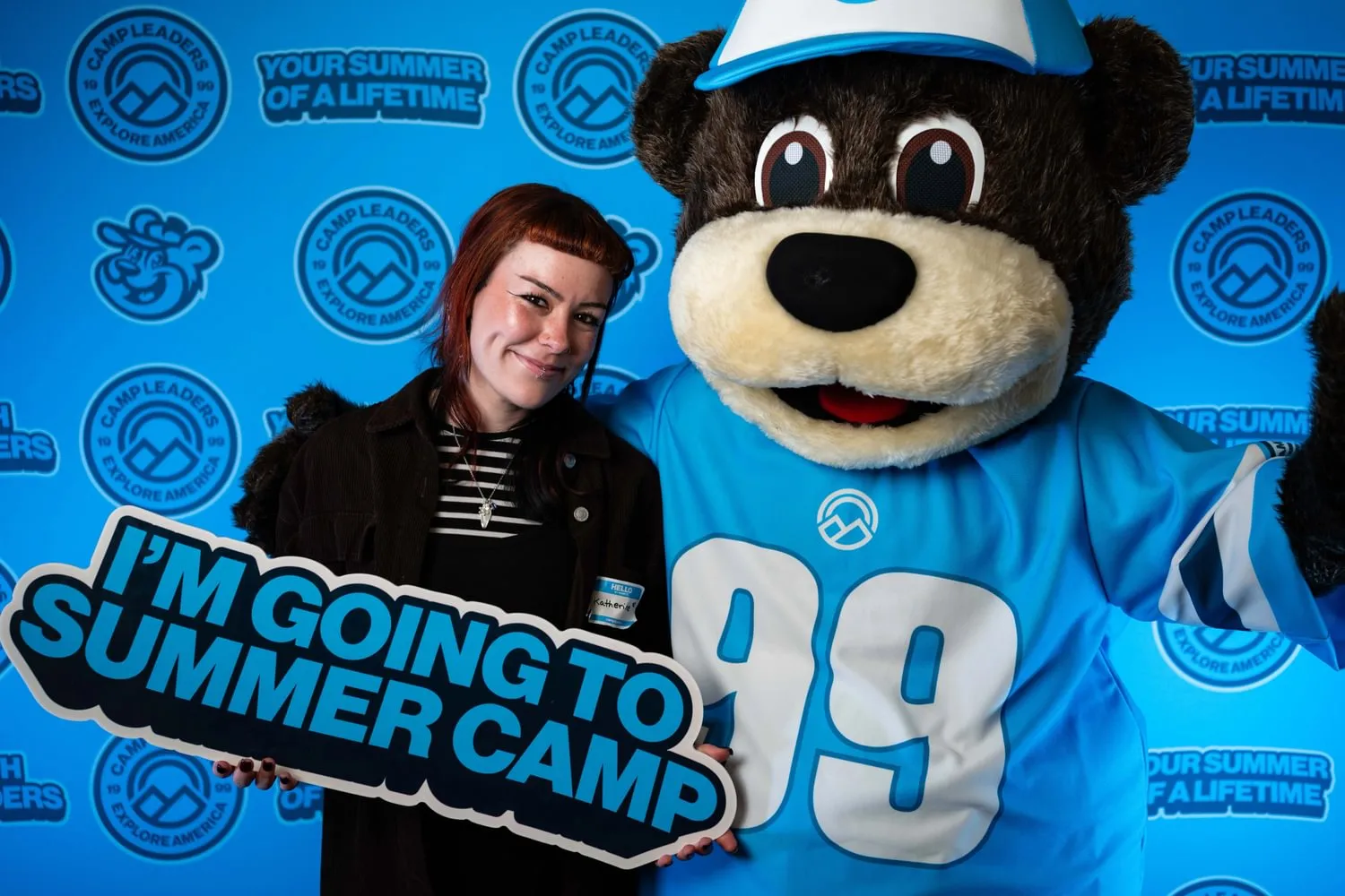 A Camp Leaders participant and Andy the Bear at a hiring fair