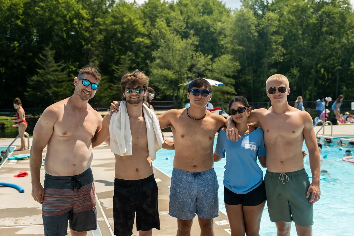 Camp counselors by the pool