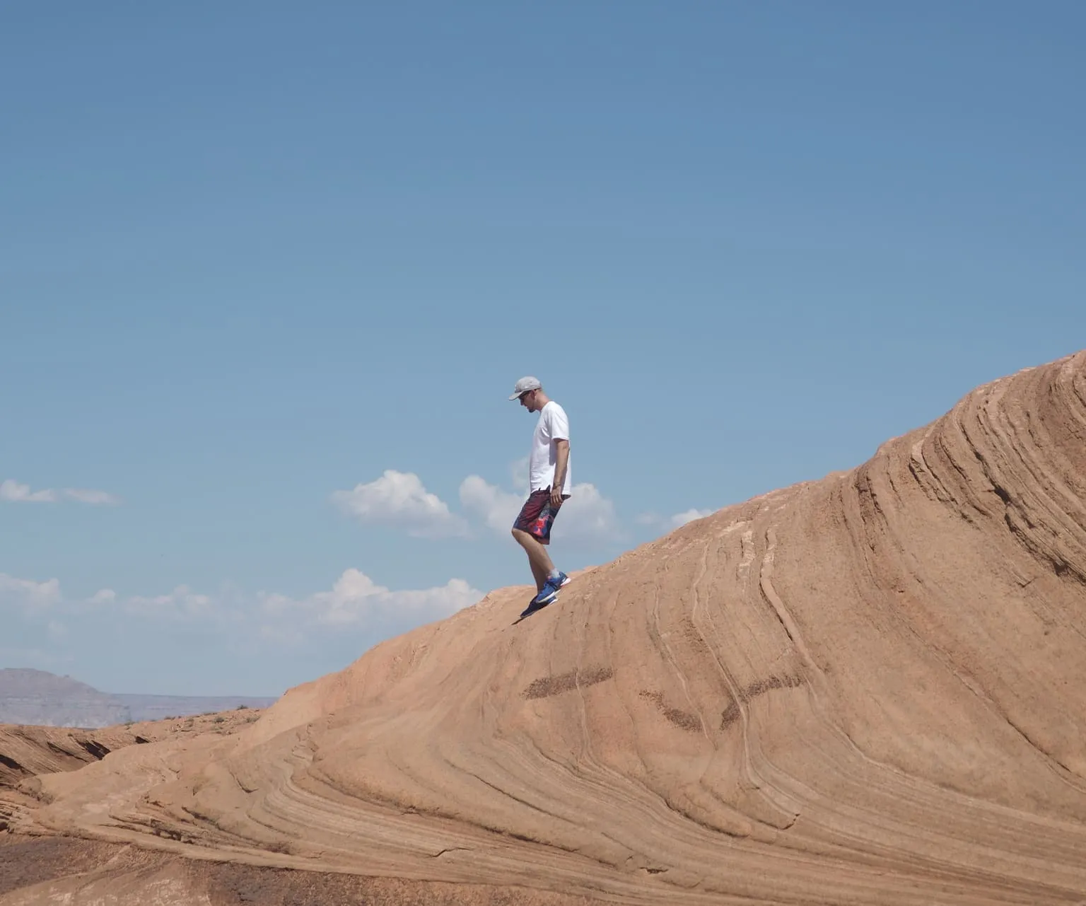 A man walking on a canyon surface