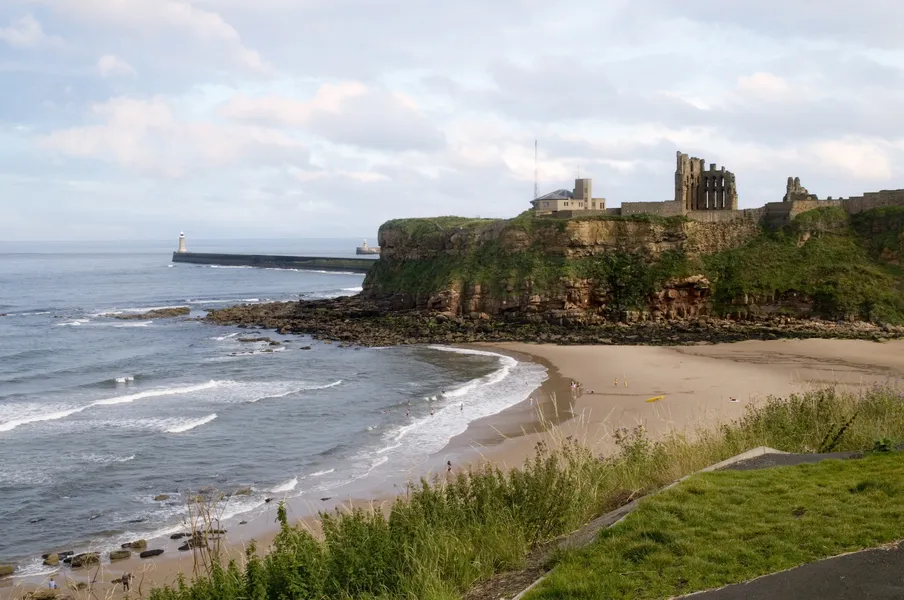 Tynemouth beach with the priory and pier in the distance