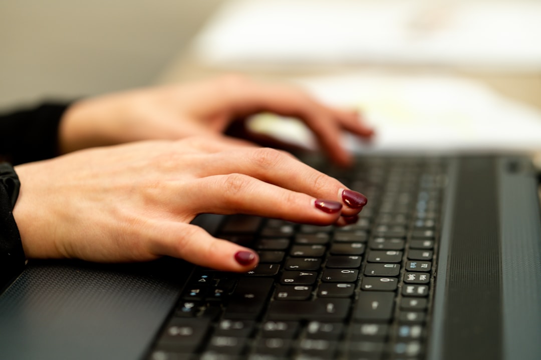 Persons hand on black laptop computer for How to Design Mobile-First Forms That Actually Convert: A Guide for Small Business Websites