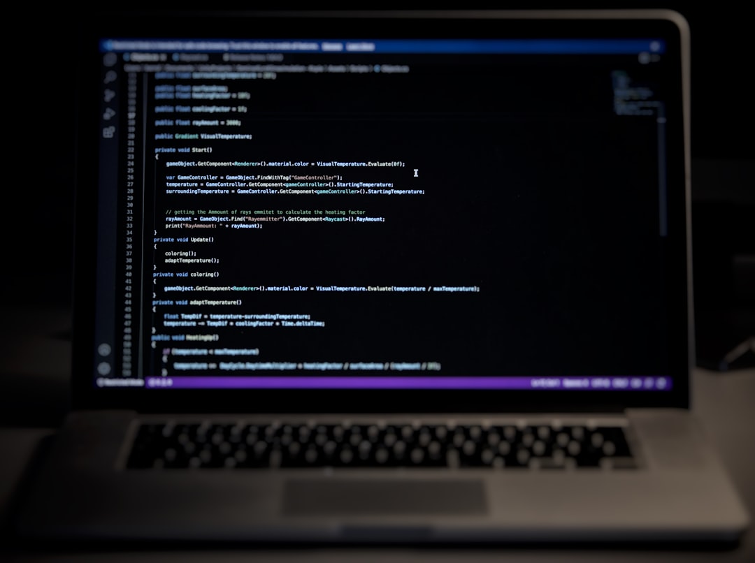 A laptop computer sitting on top of a desk for "How to Choose Between Node.js and Python for Your Small Business Backend: A Practical Comparison Guide"