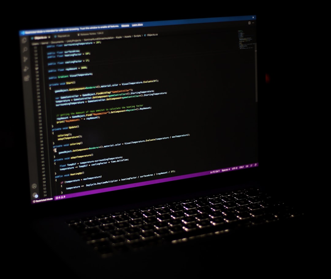A laptop computer sitting on top of a desk for "How to Choose Between Node.js and Python for Your Small Business Backend: A Practical Comparison Guide"