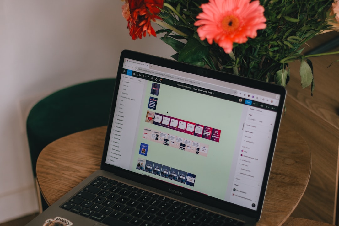 A laptop computer sitting on top of a wooden table for How We Restructured Our Design Process to Deliver Projects 40% Faster Without Sacrificing Quality