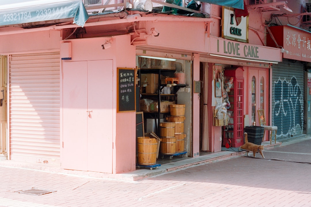 A pink storefront with "i love cake" sign for How a Local Bakery Increased Online Orders by 40% with a Mobile-First Website Redesign
