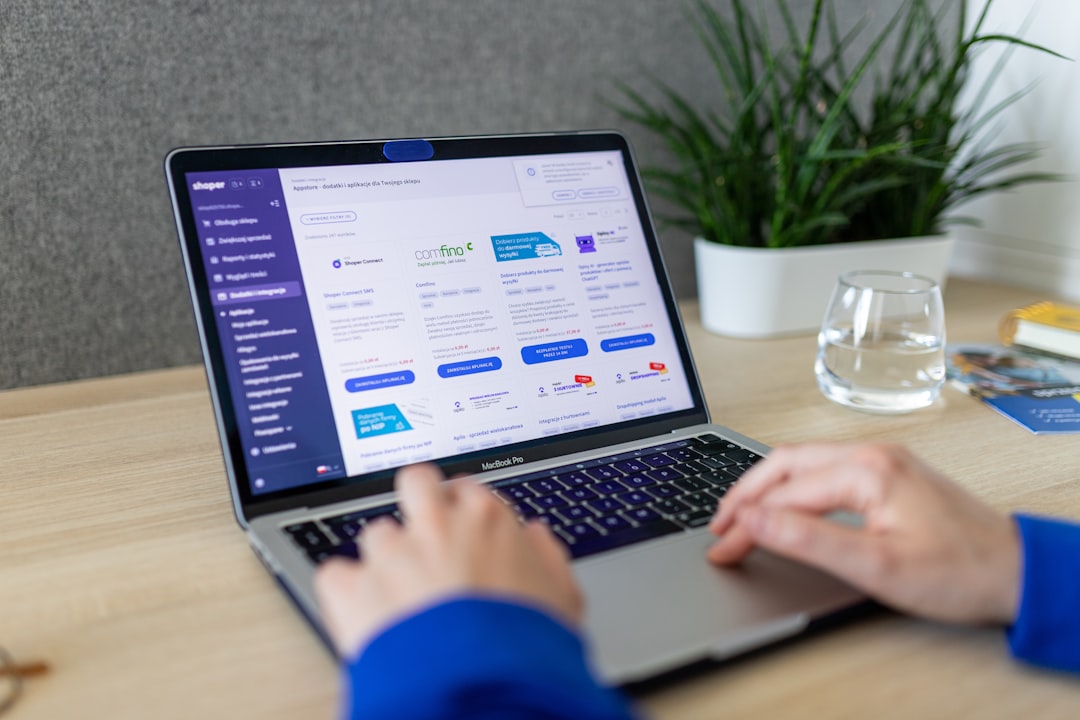A person typing on a laptop on a table for How to Segment Your Email List for Higher Open Rates and Customer Engagement