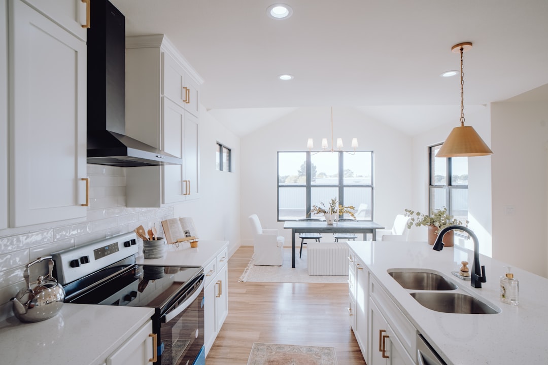 A kitchen with a sink, stove, and a window for How to Choose Between Node.js and Python for Your Small Business Backend: A Practical Comparison