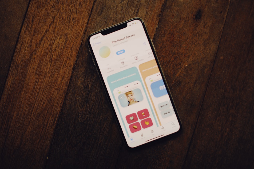 A cell phone sitting on top of a wooden table for How to Design Mobile-First Navigation That Actually Converts Small Business Customers