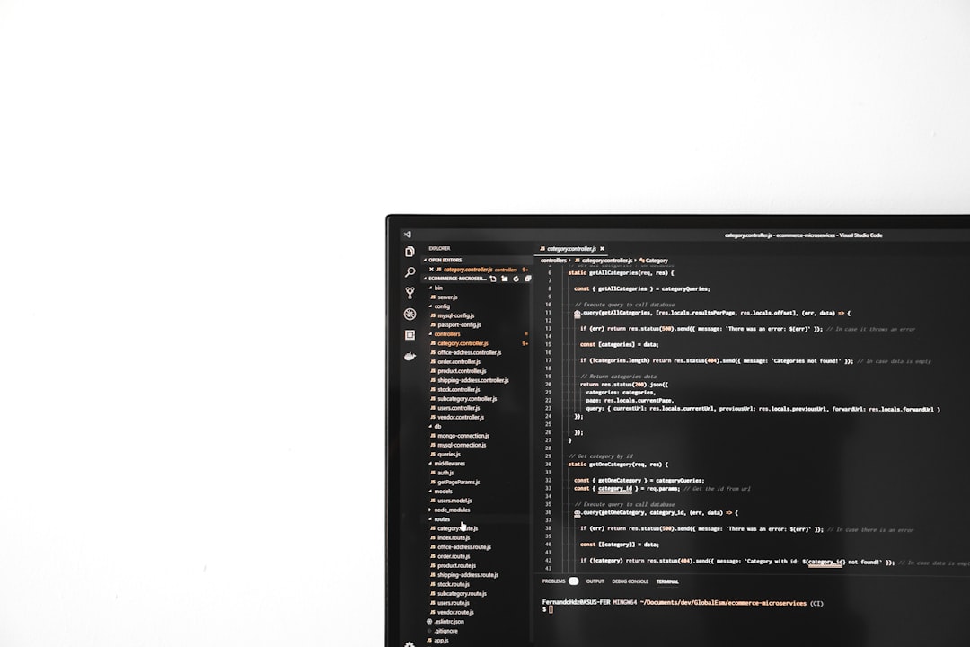 A computer monitor sitting on top of a desk for "How to Choose Between Node.js and Python for Your Small Business API: A Practical Comparison"