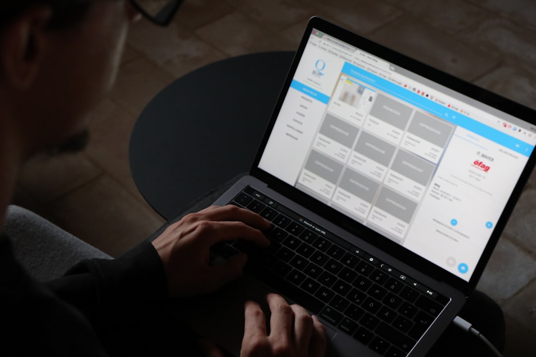 Person holding turned-on laptop computer for How to Modernize Your Website Without Starting from Scratch: A Phased Makeover Strategy for Small Businesses