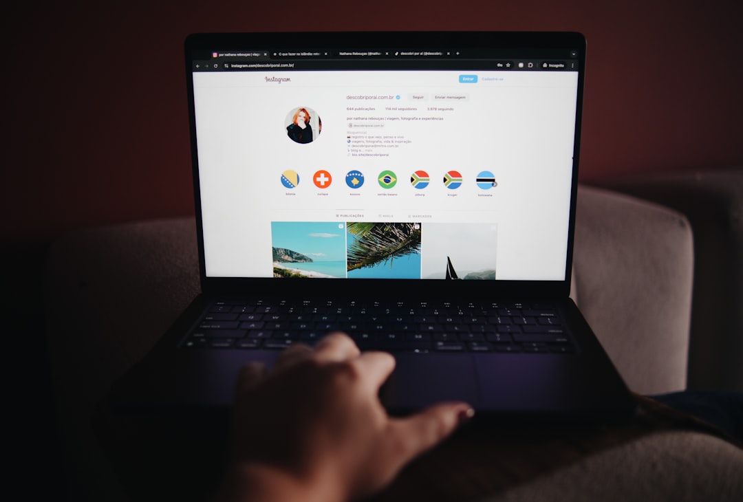 A person sitting on a couch using a laptop for How to Optimize Your Google Business Profile for Local Search Rankings