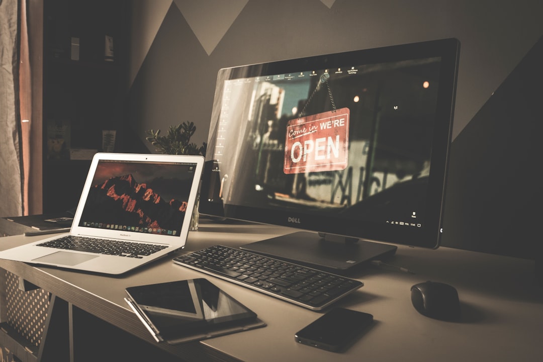 A laptop computer sitting on top of a desk for "How to Cut PPC Costs in Half: A/B Testing Strategies That Actually Work for Small Budgets"