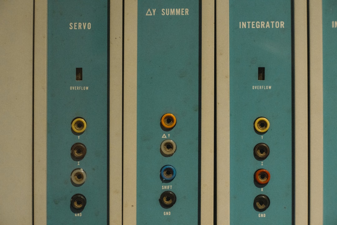 A row of blue and white electrical switches for "How to Choose Between Monolithic and Microservices Architecture: A Guide for Growing Businesses"