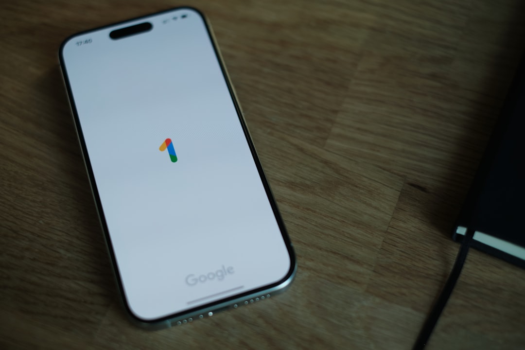A close up of a cell phone on a table for "How to Calculate True ROI on Google Ads: A Budget Tracker Template for Small Businesses"
