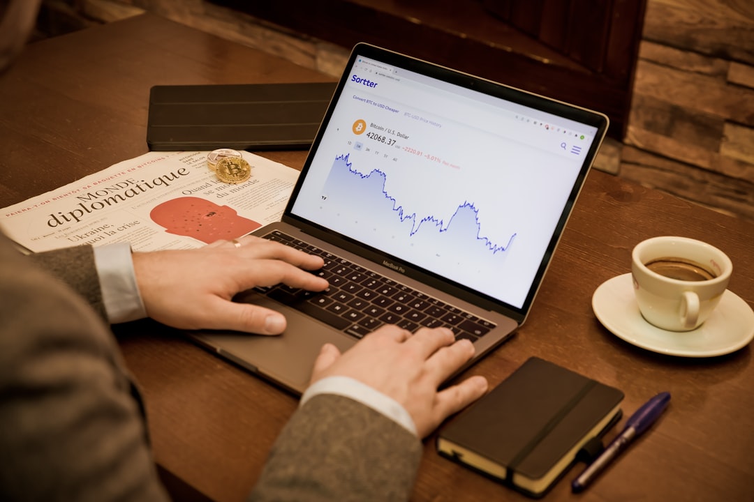 A person using a laptop on a wooden table for How to Segment Your Email List to Increase Click-Through Rates and Sales