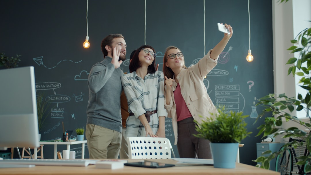 Three colleagues taking a selfie in the office for How We Redesigned Our Client Onboarding Process to Cut Project Timeline by 30%
