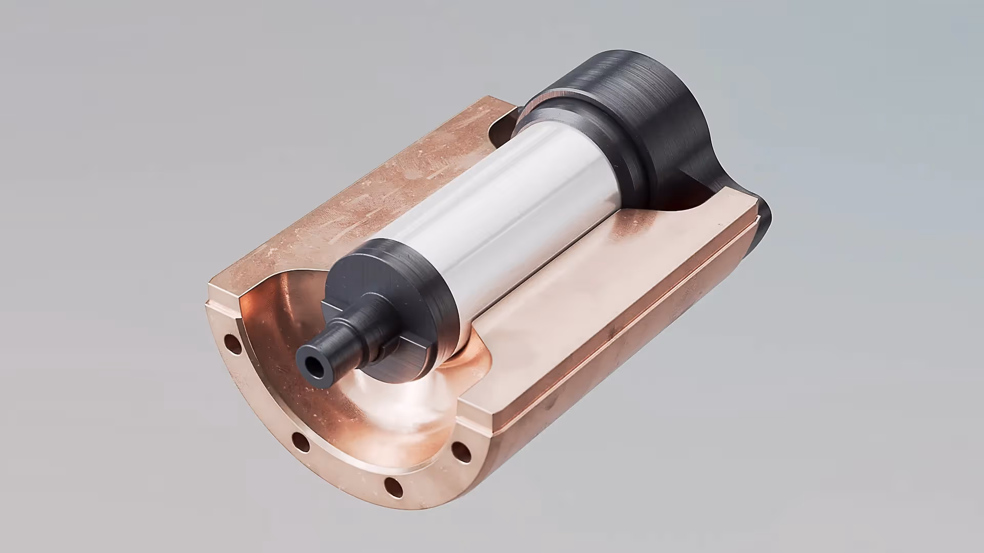 Präzisionsbauteil mit zylindrischem Metallkern und schwarzen Enden in Kupferhalterung vor grauem Hintergrund, Symbol für industrielle Funktionalität.