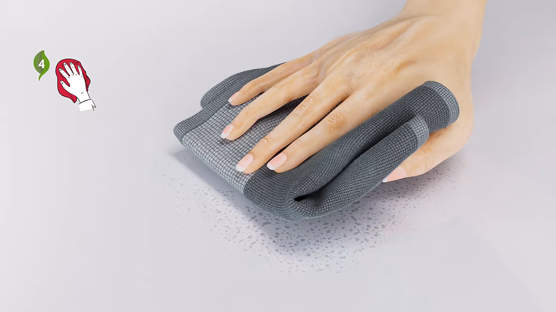 Hand wischt mit grauem Mikrofasertuch Flüssigkeit auf weißer Oberfläche – nachhaltige Reinigung Schritt 4.