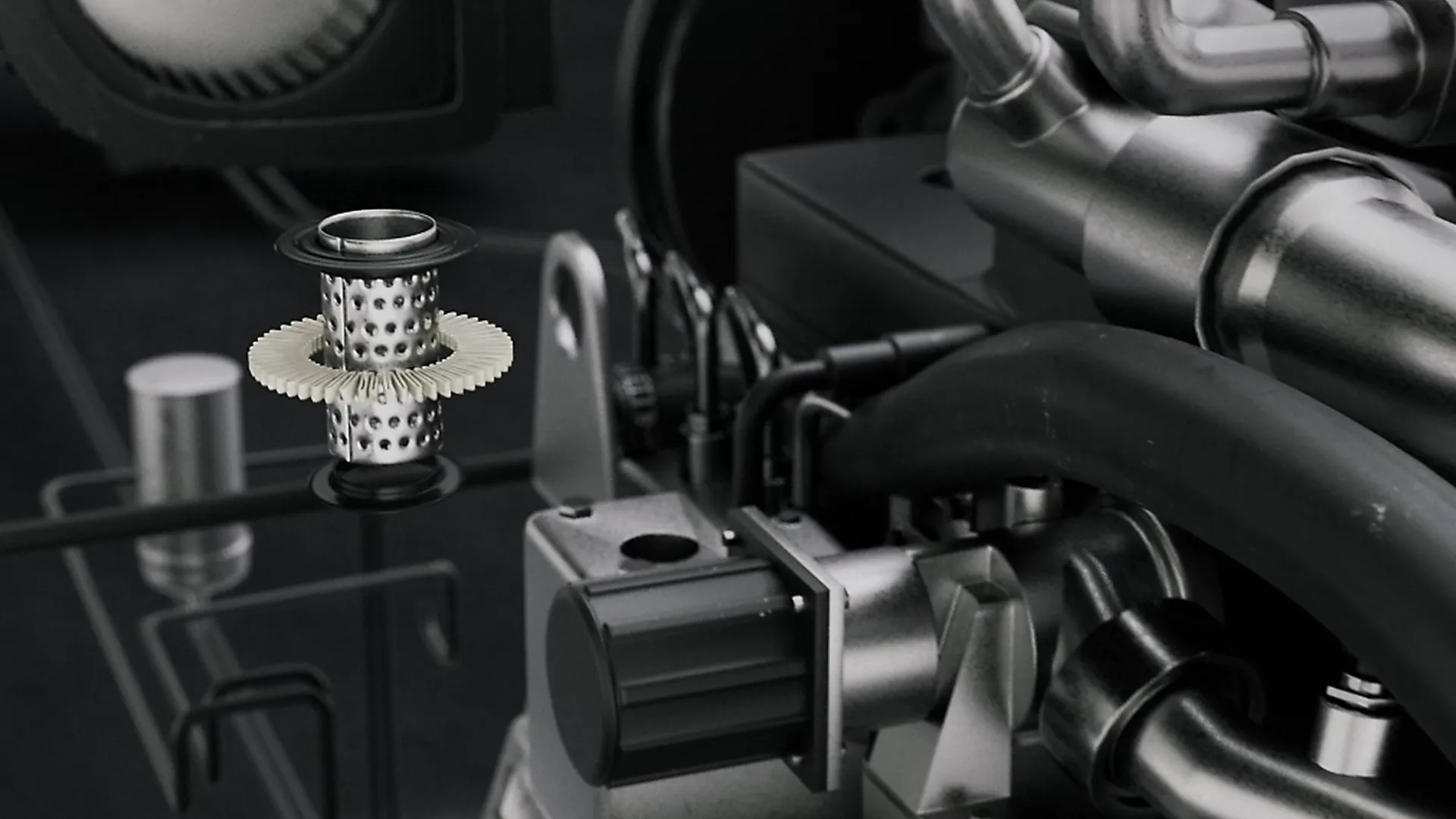 3D-Rendering eines metallischen Auto-Filters vor Motor mit Schläuchen, Rohren und sichtbaren Motorteilen.