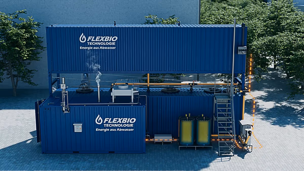 3D rendering of two stacked blue Flexbio containers with pipes, stairs, tanks, and steam release, representing modular wastewater-to-energy technology.