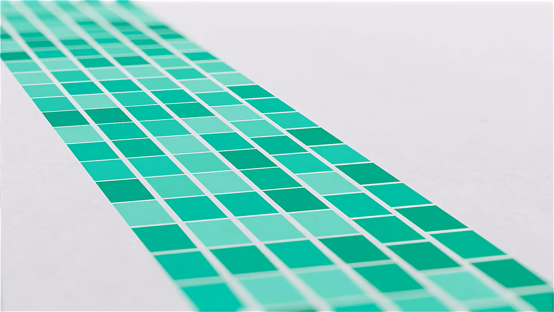 Farbige Grafik mit grünen Kacheln in moderner 3D-Optik – visuelles Element aus einer 3D-Animation oder einem Produktvideo, das Design, Struktur und Präzision in einem Werbefilm für innovative Technologien symbolisiert.