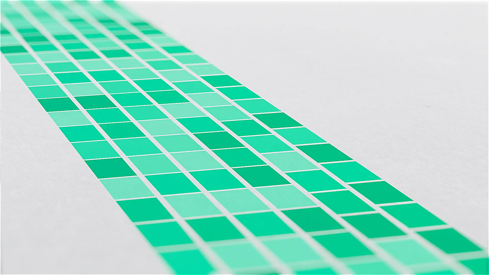 Farbige Grafik mit grünen Kacheln in moderner 3D-Optik – visuelles Element aus einer 3D-Animation oder einem Produktvideo, das Design, Struktur und Präzision in einem Werbefilm für innovative Technologien symbolisiert.