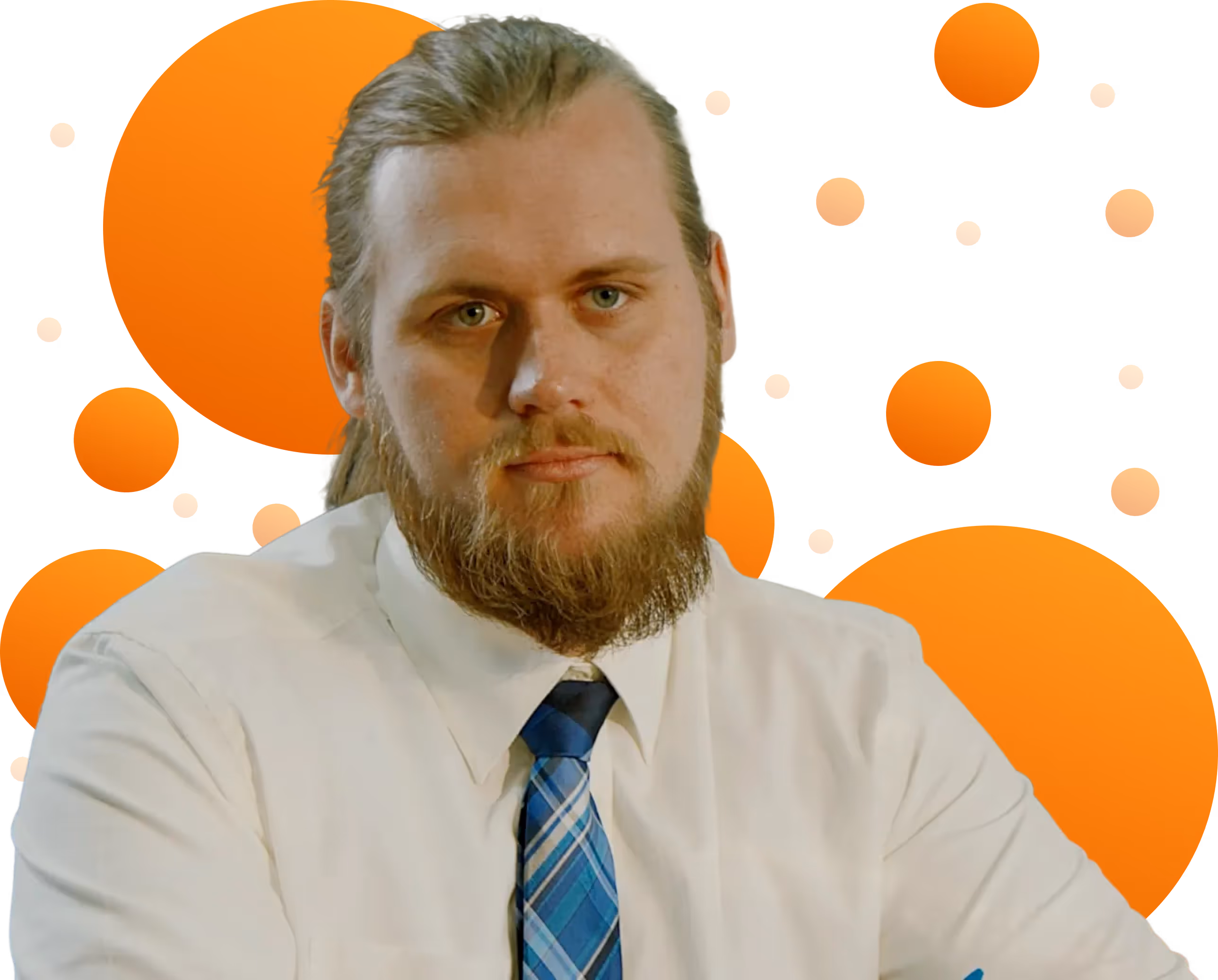 Todd, with a beard and long hair tied back, wearing a white shirt and blue plaid tie, with orange circles in the background.