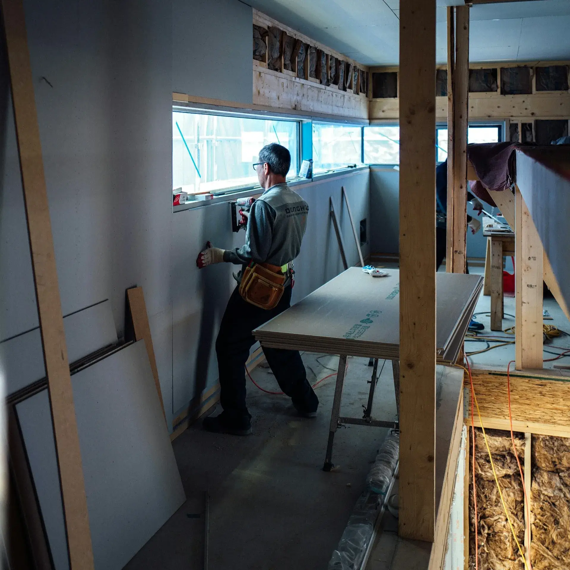 Man setting up drywall