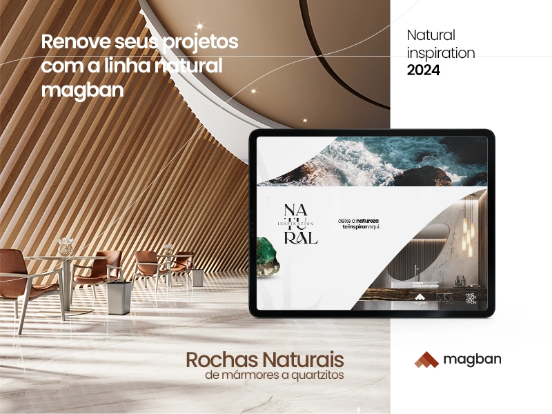 Interior moderno com paredes de madeira inclinadas, cadeiras e mesa, e tela de tablet exibindo designs naturais de rochas; texto promocional da linha natural magban para rochas naturais de mármores a quartzitos.