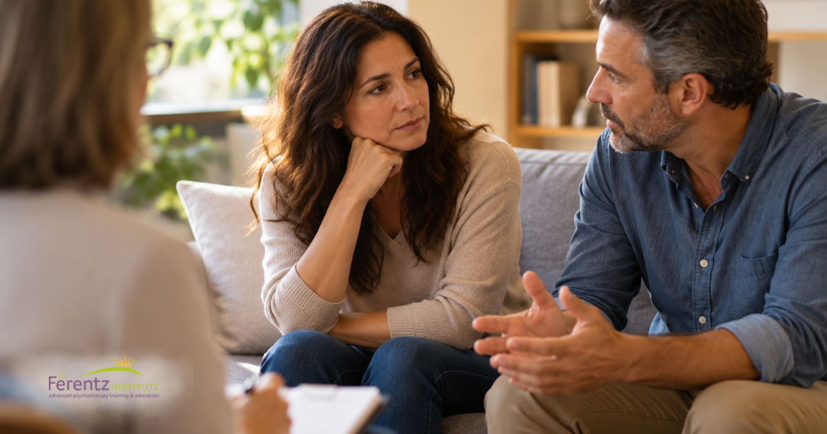 Couple having a thoughtful conversation in a therapist’s office.