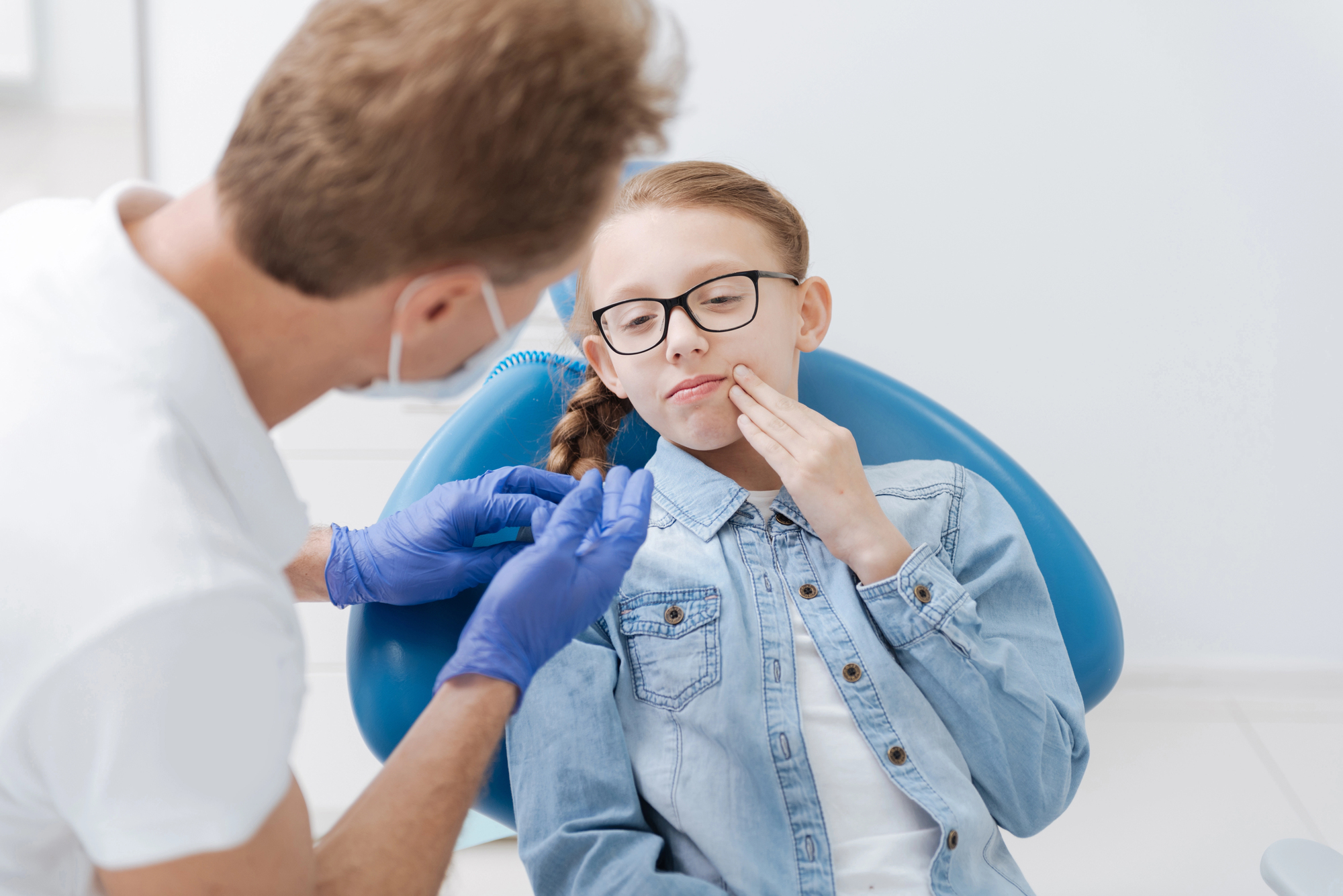 Kid getting checked by a dentist in Charlotte NC 