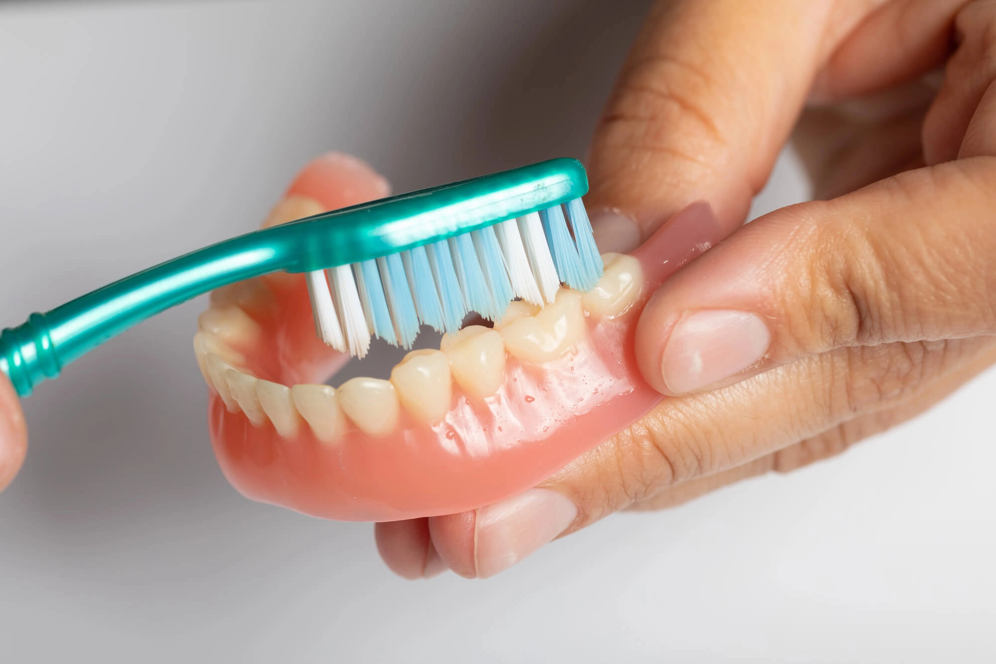 Brushing dentures Charlotte NC