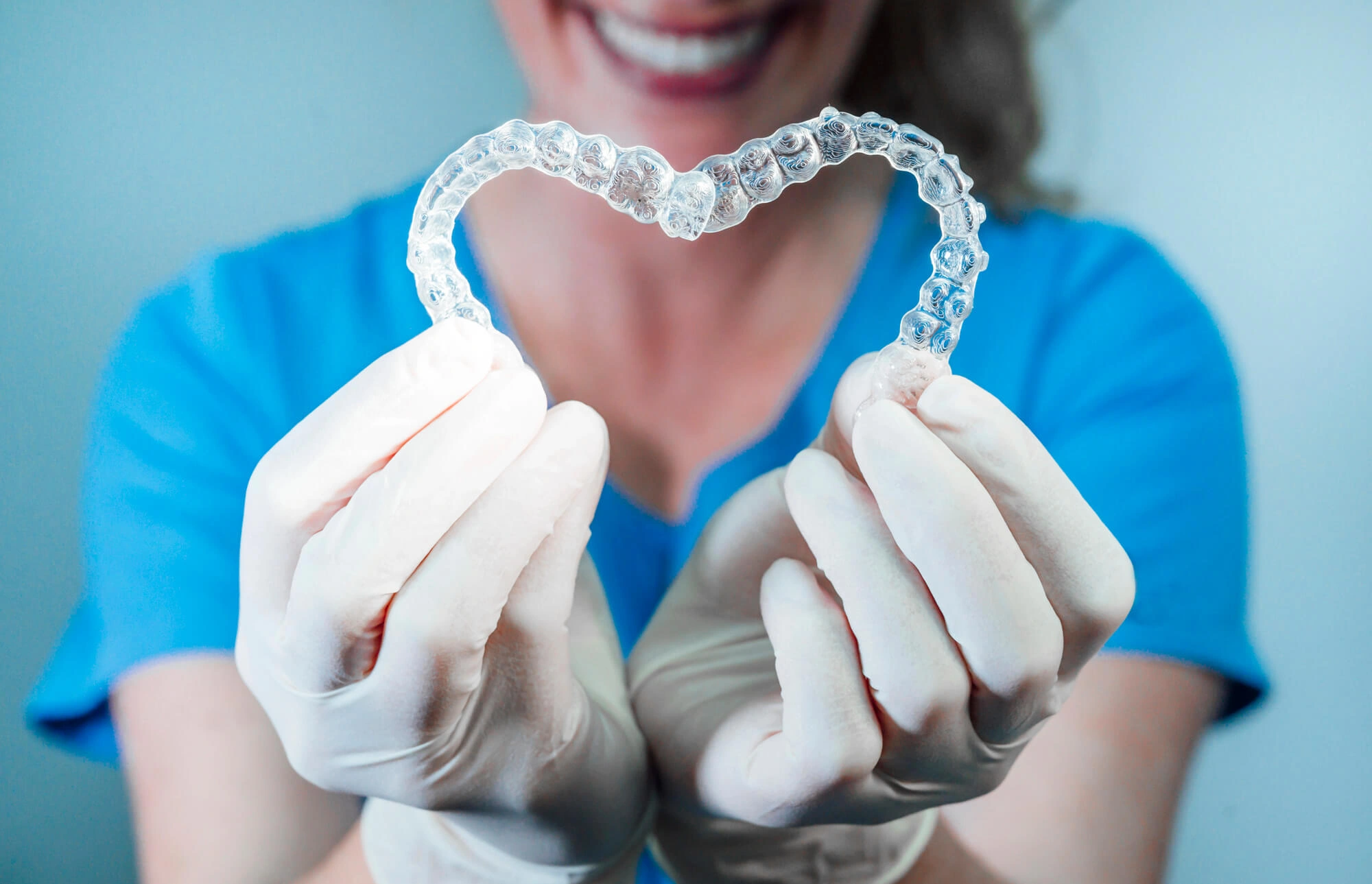 Dentist holding Invisalign Dilworth NC