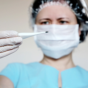 Nurse with thermometer