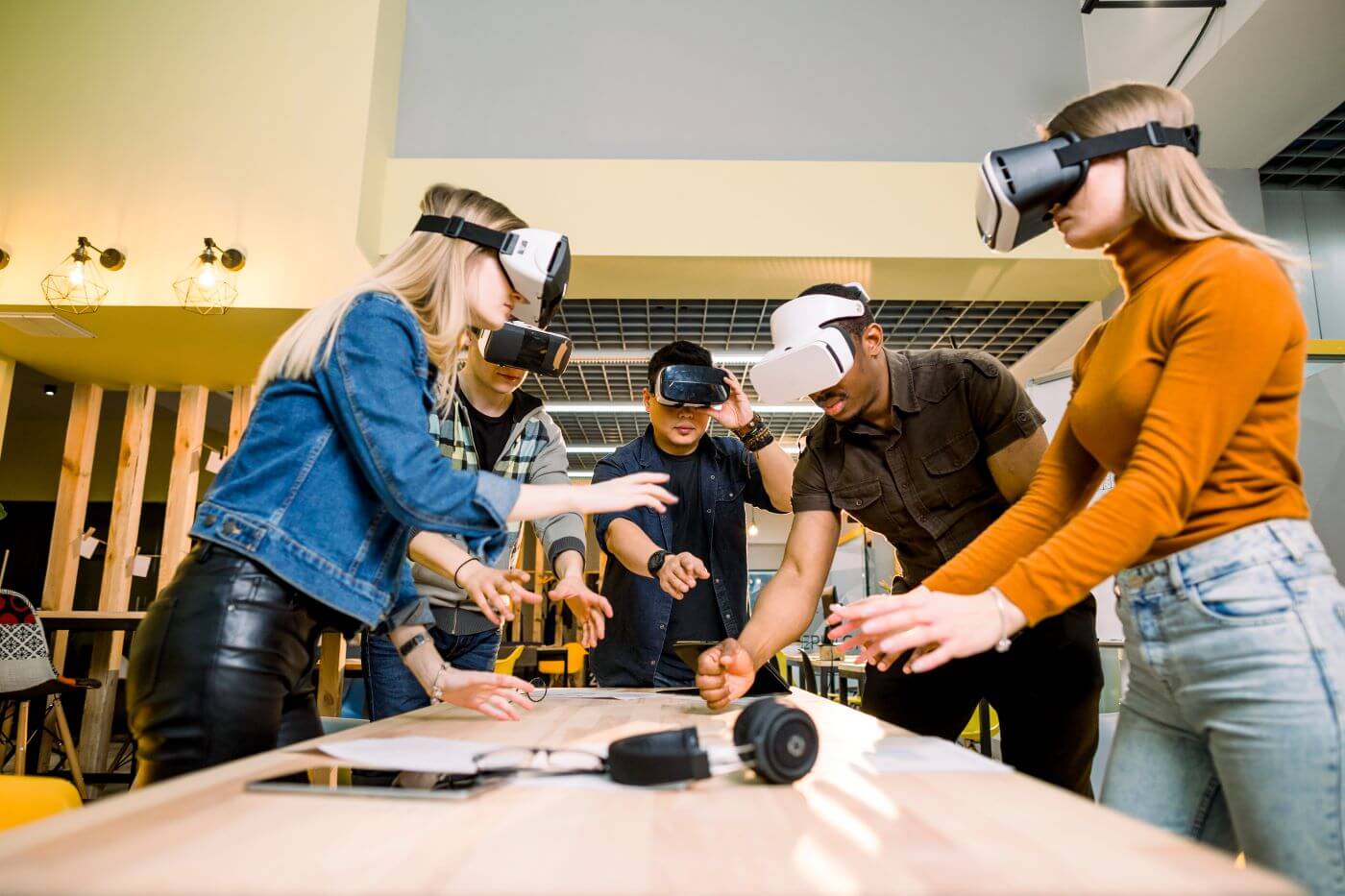 Colleagues using VR headsets during a team building session in Dubai