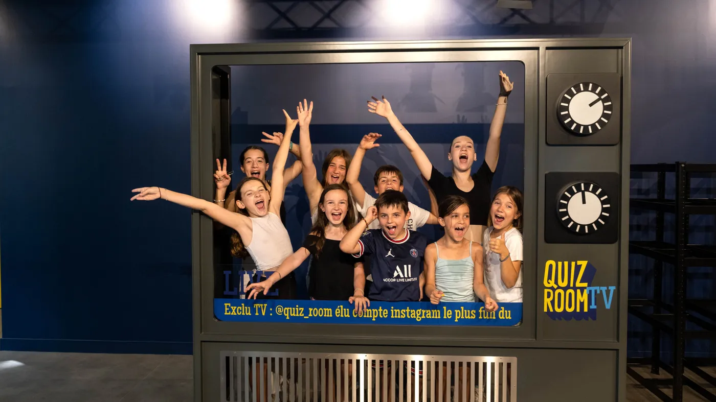 Children buzzing in a game show-style birthday quiz at Quiz Room Dubai