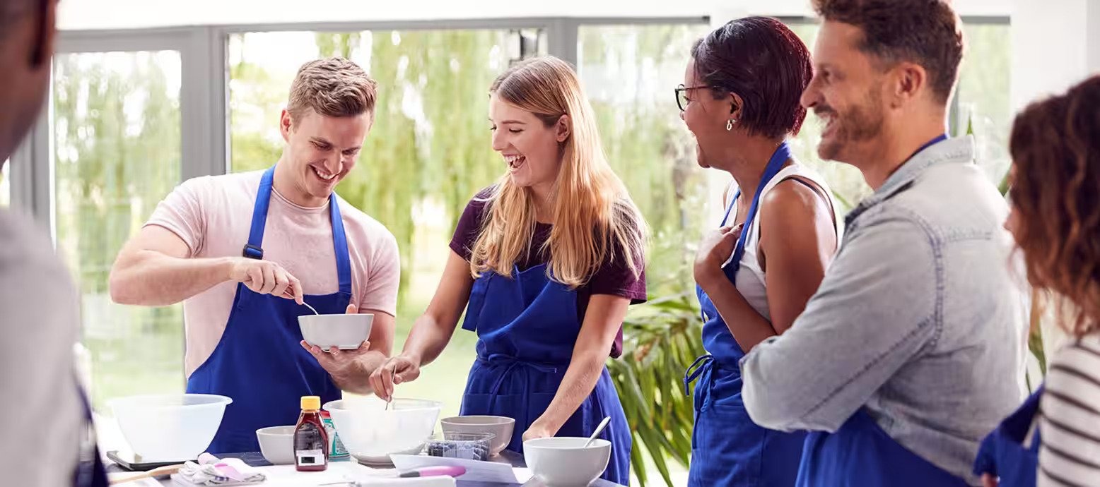 Team cooking class with blue aprons in Dubai