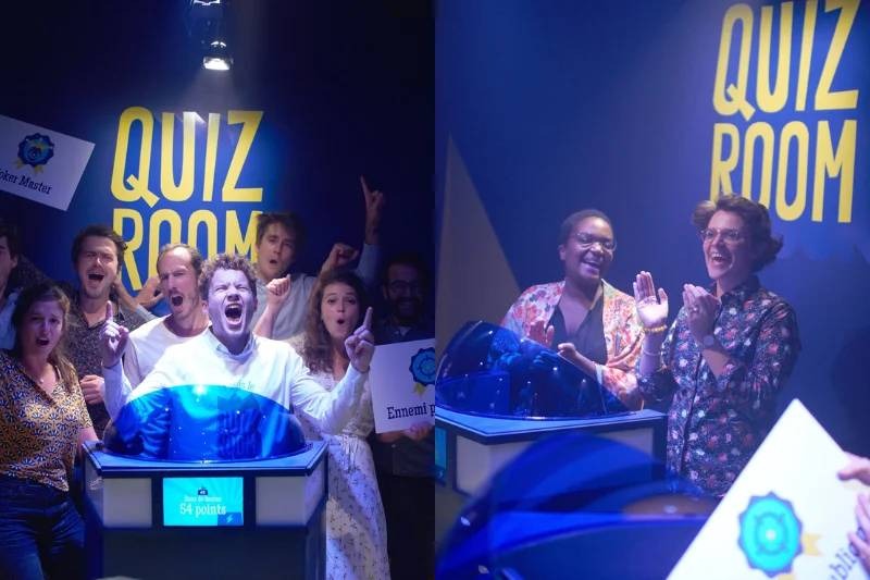 Coworkers enjoying a high-energy quiz game for team building in Dubai