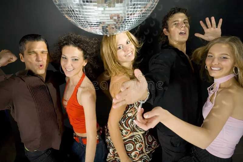 Teenagers dancing under a disco ball at a birthday party in Dubai