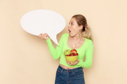 Пirl holding a bowl of fresh fruit