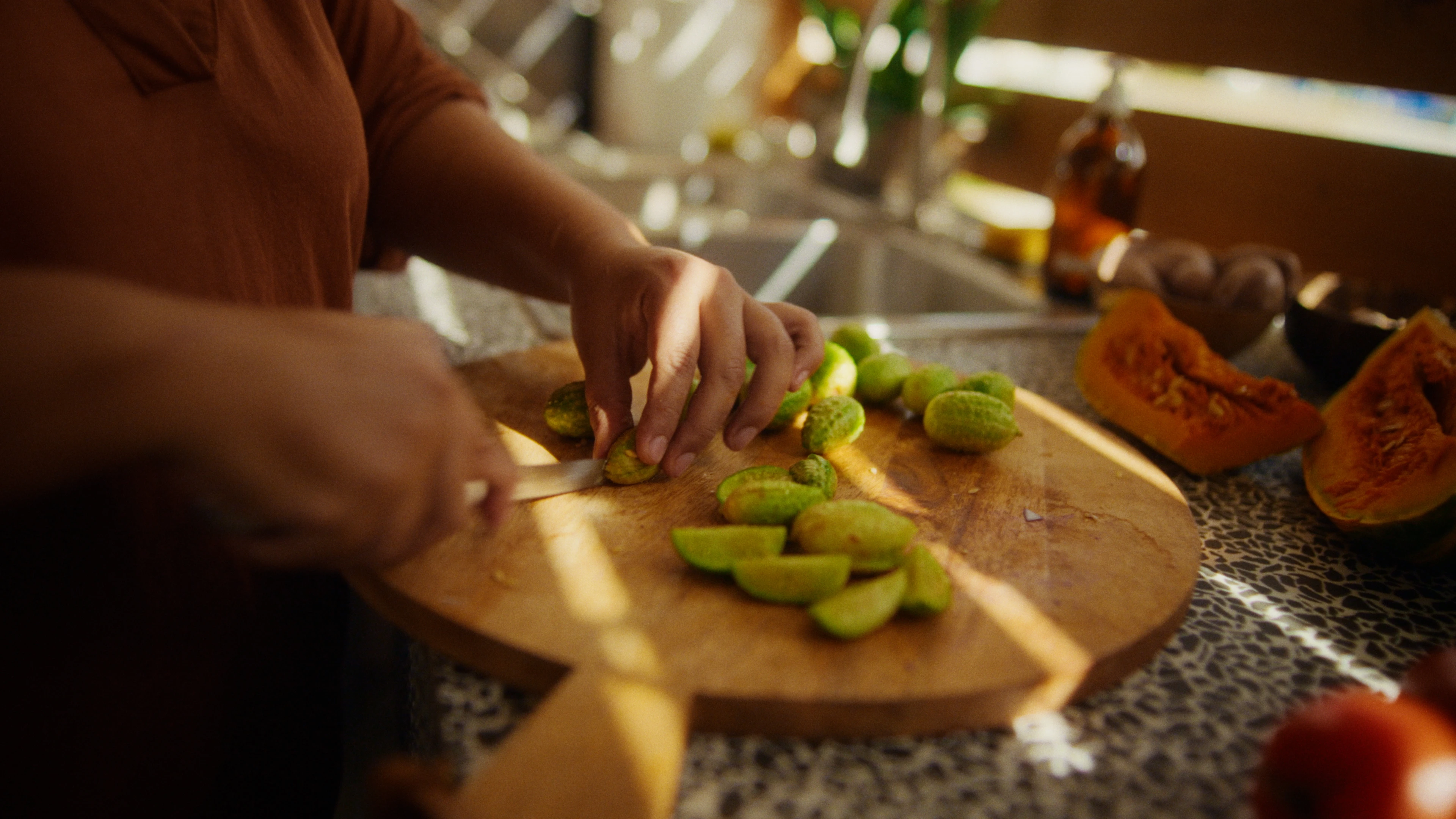 Woman cutting vegetables on cutting board