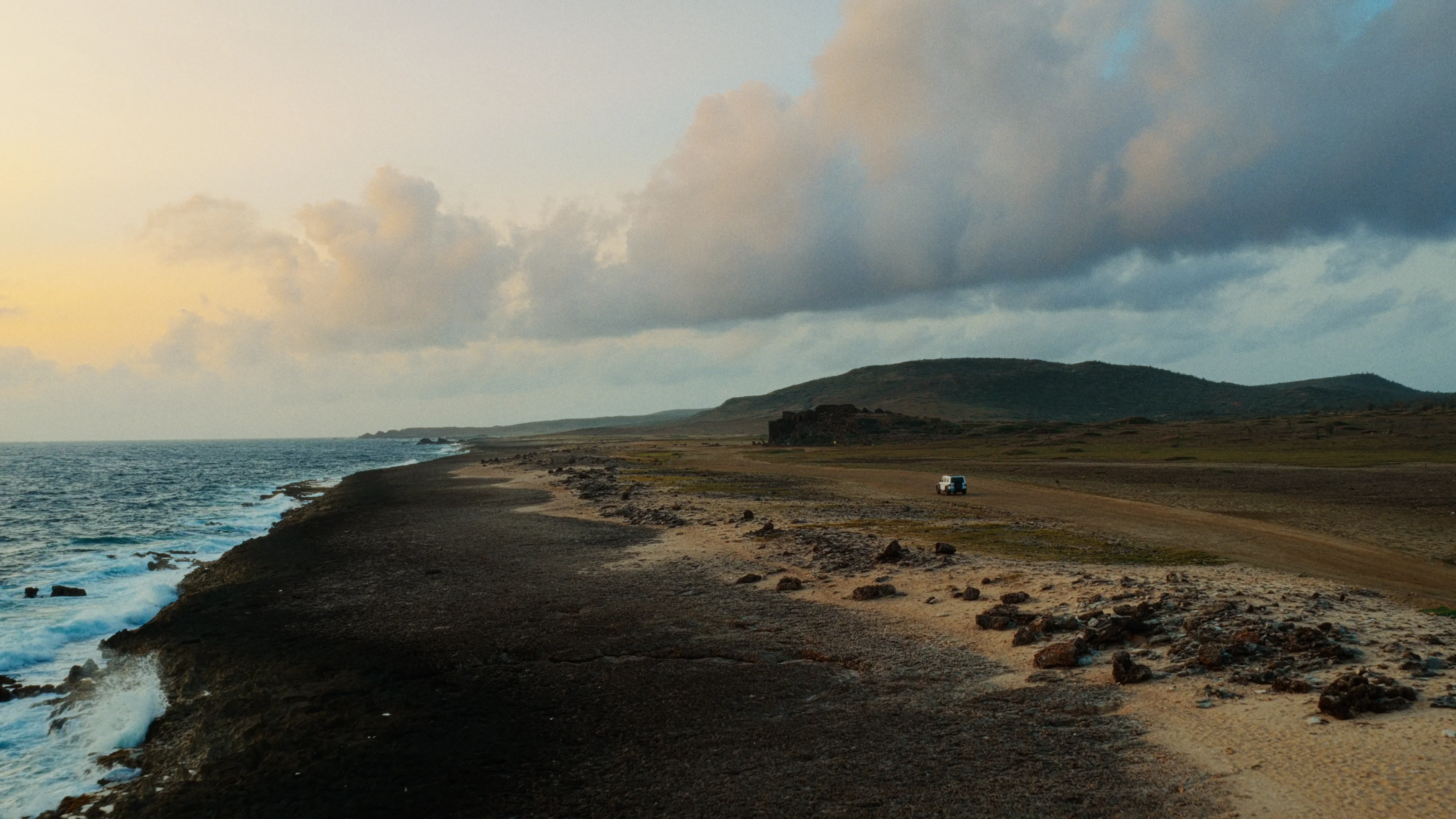 Jeep driving along the coast