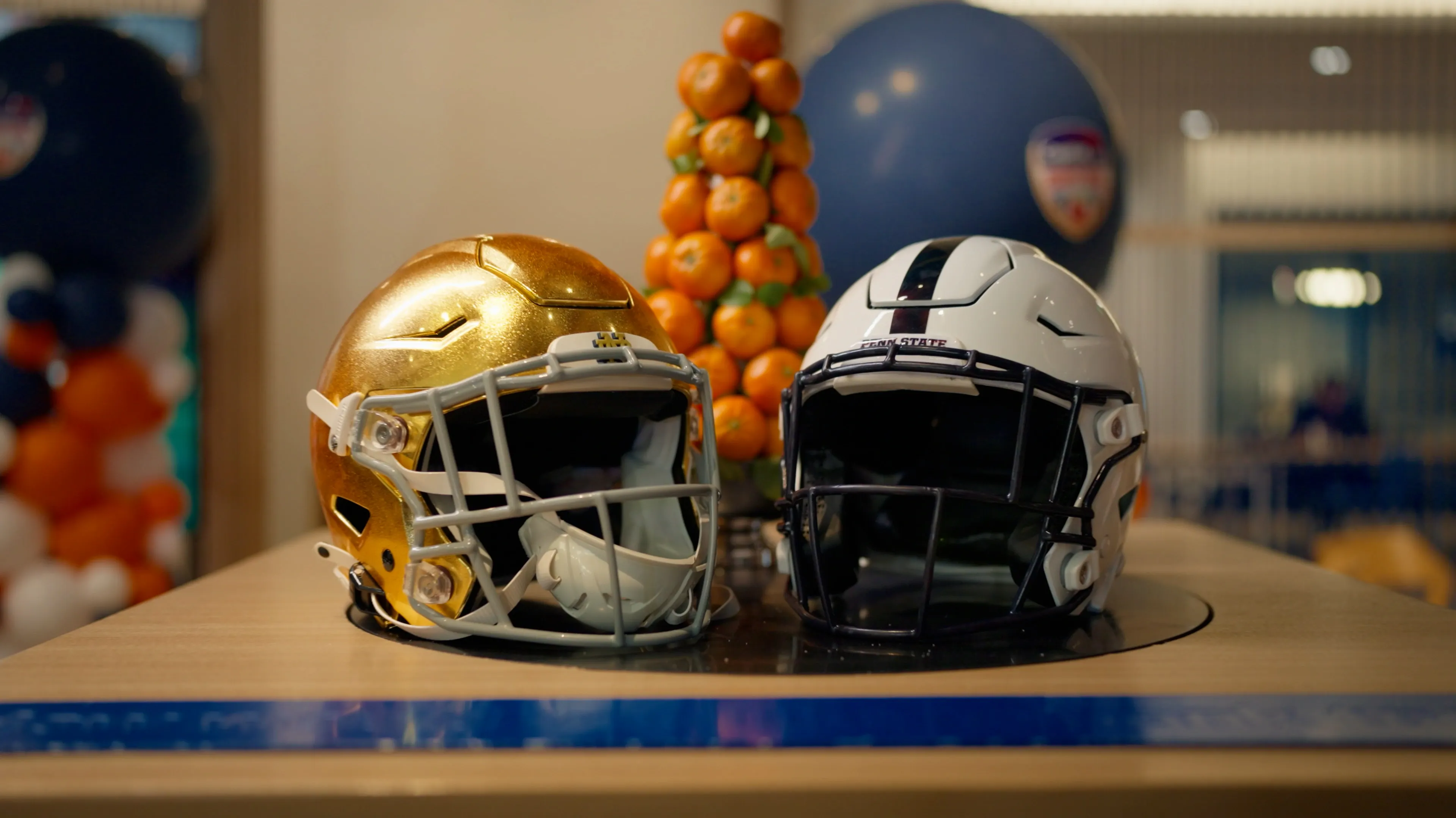 Two football helmets on a table