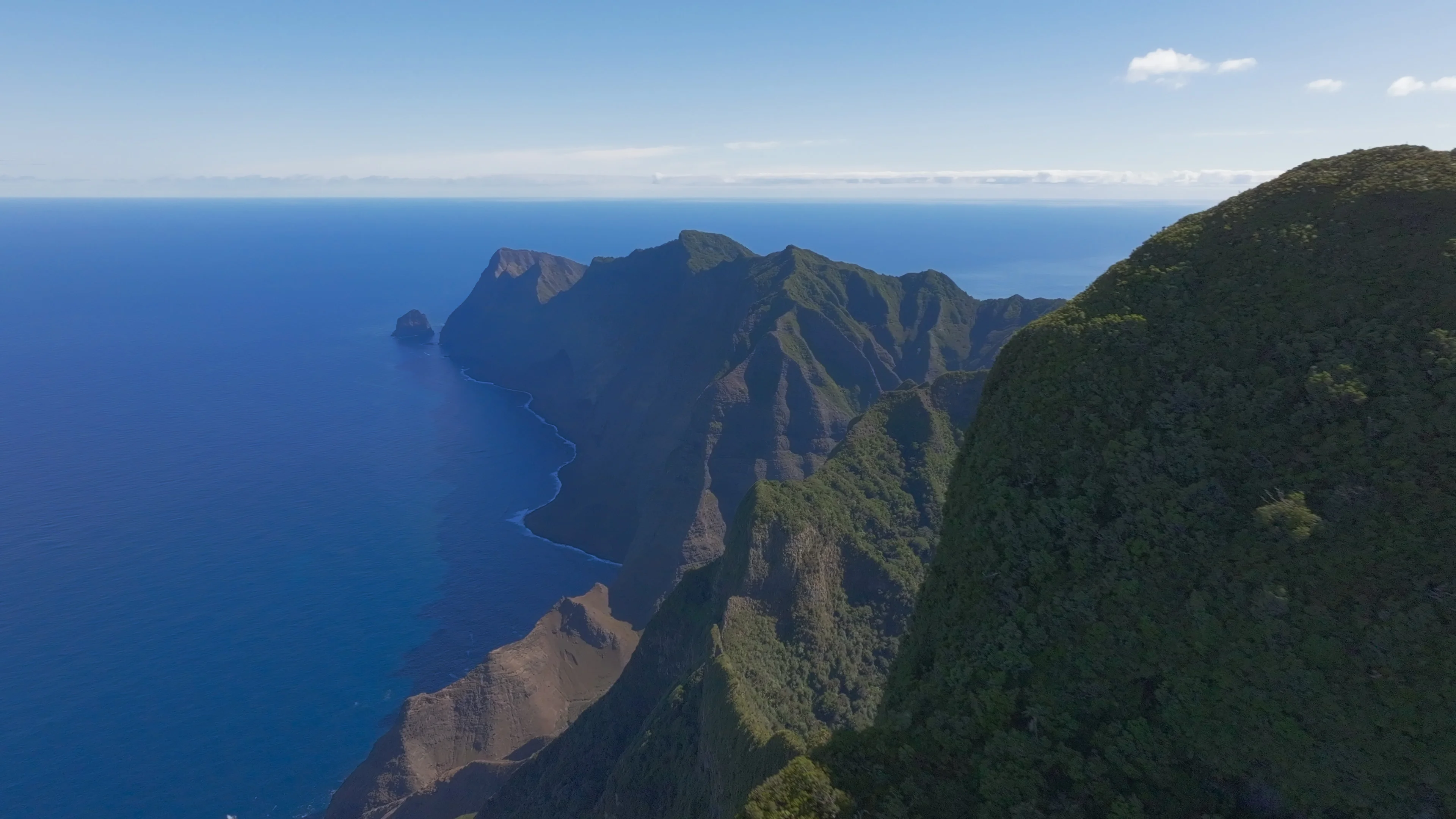 mountain range against the ocean
