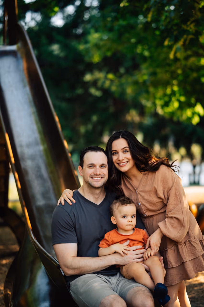 a man and woman with a baby