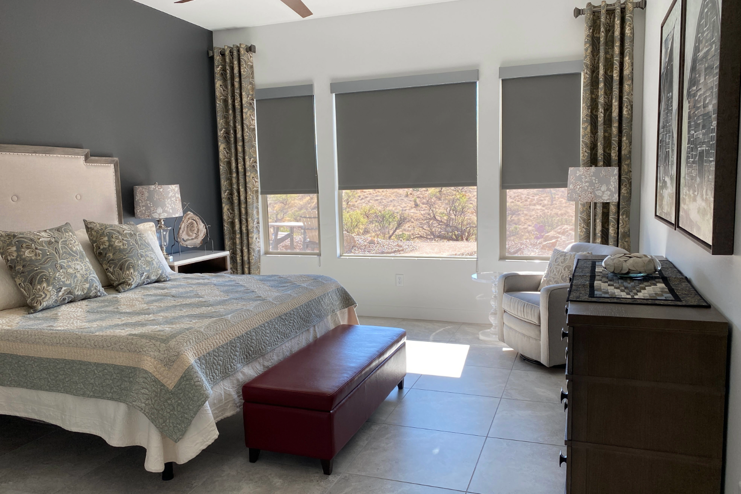 Bedroom with closed gray window shades.