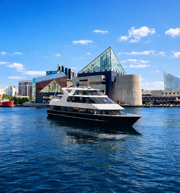 A large boat floating on top of a body of water.