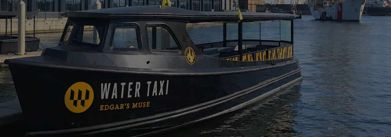 A black and yellow boat in the water.