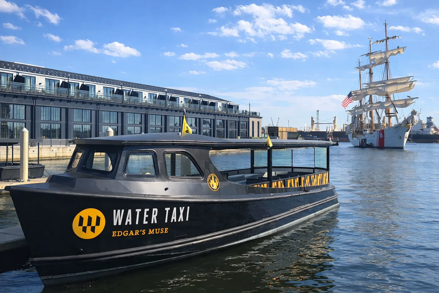 A black and yellow boat is in the water.