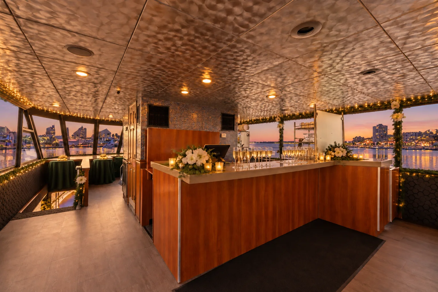 Champagne flutes lined up on the upper salon bar aboard Lady Thames